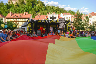 People at town square against sky