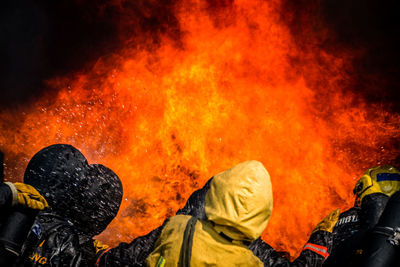 Low angle view of people on bonfire