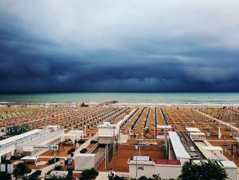 High angle view of sea and buildings against sky