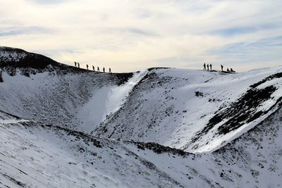 Scenic view of mountains against sky during winter