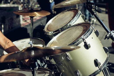 Cropped hand of man playing drums
