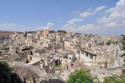 Buildings in town against sky