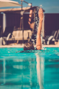 Woman swimming in pool