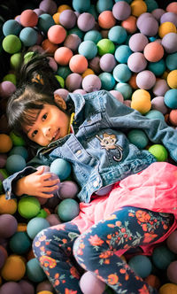 High angle view of cute girl with toy