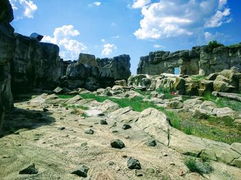 Panoramic view of rock formations against sky