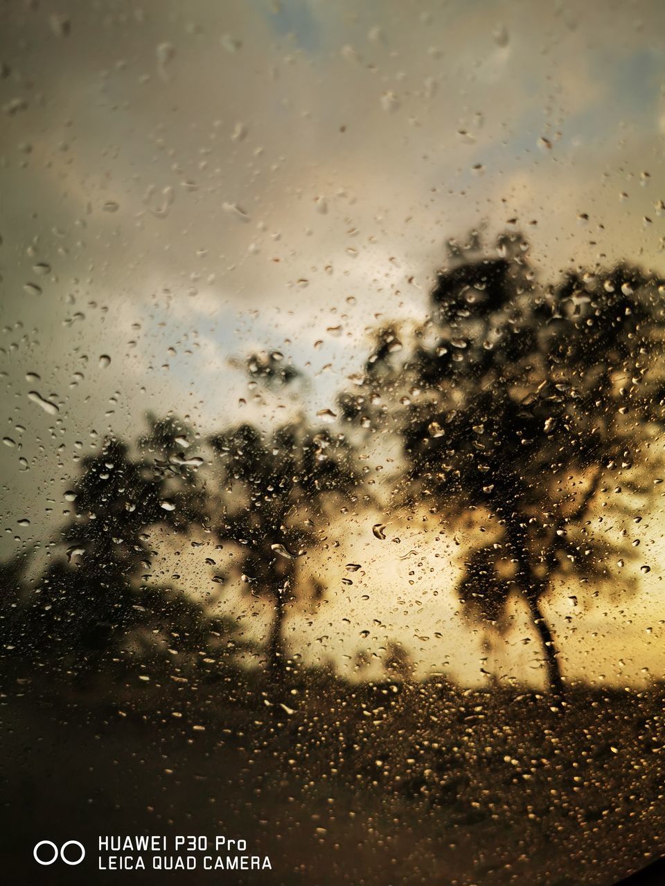 transparent, window, drop, glass - material, wet, water, rain, nature, indoors, vehicle interior, no people, sky, close-up, mode of transportation, glass, car, focus on foreground, transportation, rainy season, raindrop, road trip