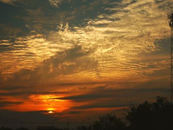 Scenic view of dramatic sky over sea during sunset