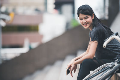 Smiling young woman looking away outdoors