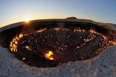 High angle view of burnt landscape against sky