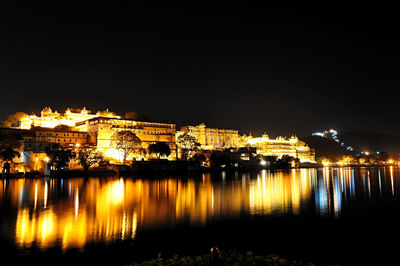 Illuminated city at waterfront