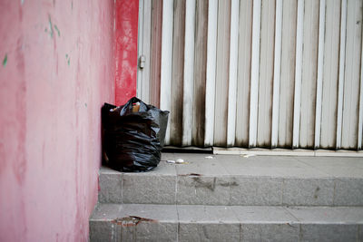 Black plastic bag on wall