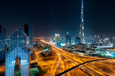 Illuminated city buildings at night