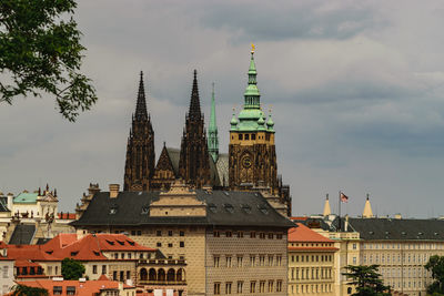 Tower amidst buildings against sky in city