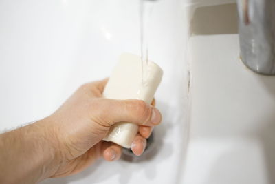 Close-up of human hand holding cup