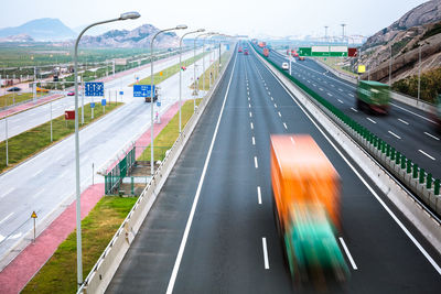 Blurred motion of vehicles on road in city