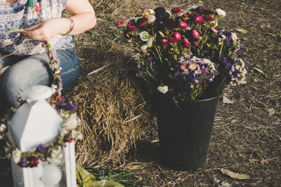 Close-up of woman hand flowers