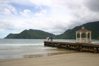 Scenic view of sea against cloudy sky