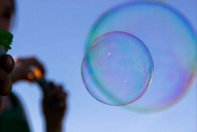 Close-up of bubbles against blue background