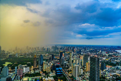 Aerial view of cityscape against sky