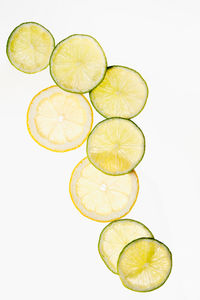 Slices of fresh lemon on a white background