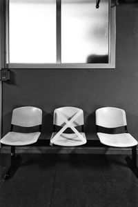 Empty chairs and tables in restaurant