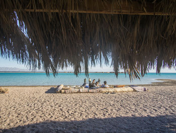 People relaxing on beach