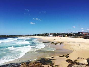 View of beach against blue sky