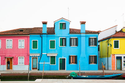 Residential buildings against blue sky