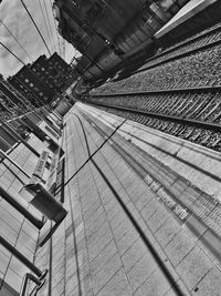 Tilt image of communications tower in city