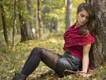 Young woman sitting outdoors