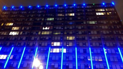 Low angle view of illuminated building at night