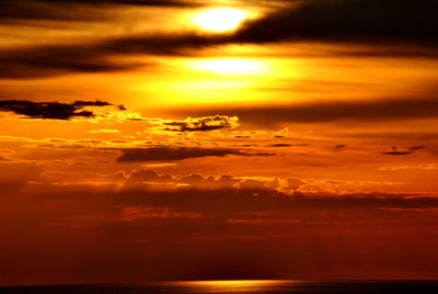 Scenic view of sea against orange sky