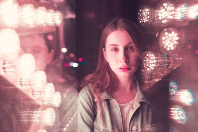 Portrait of woman with illuminated lights