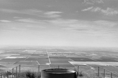 Airplane on runway against sky