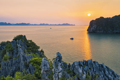Scenic view of sea against sky during sunset