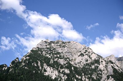 Low angle view of rocks against sky