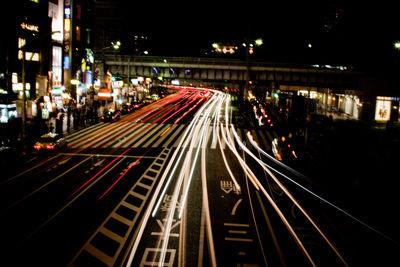 High angle view of light trails on city street at night