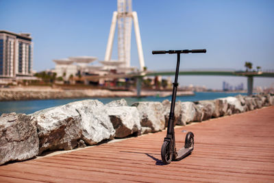 Dubai, uae, april 2019 electric scooter on the background of the island of blue waters in dubai
