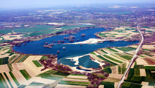 Aerial view of lake amidst agricultural field