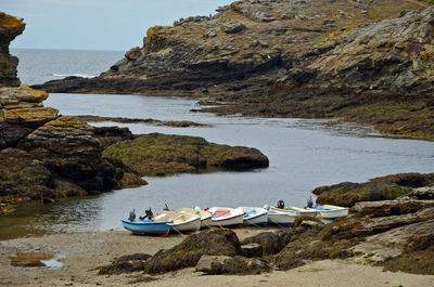 Boats moored at sea shore