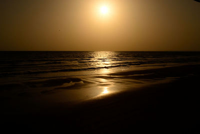 Scenic view of sea against clear sky during sunset