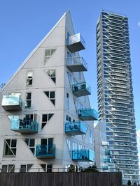 Low angle view of modern buildings against clear sky