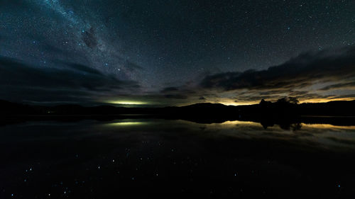 Lake under the milkyway in tasmania australia