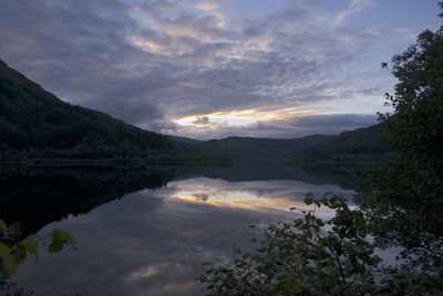 Scenic view of lake against sky during sunset