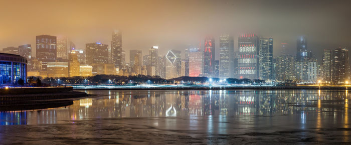 Illuminated buildings in city at night