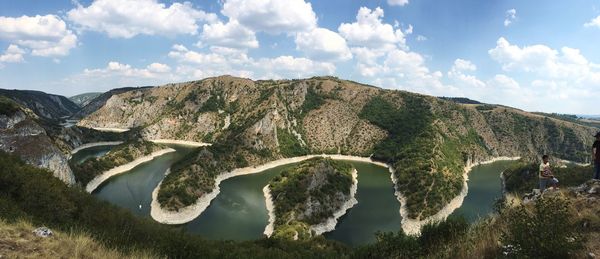 Panoramic view of lake and mountains against sky