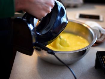 Close-up of man preparing food in bowl