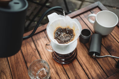 Barista dripping coffee and slow coffee bar style