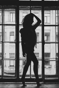 Woman walking on window sill