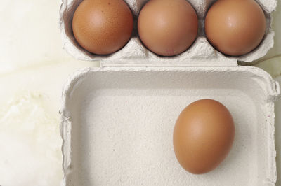 High angle view of eggs in container
